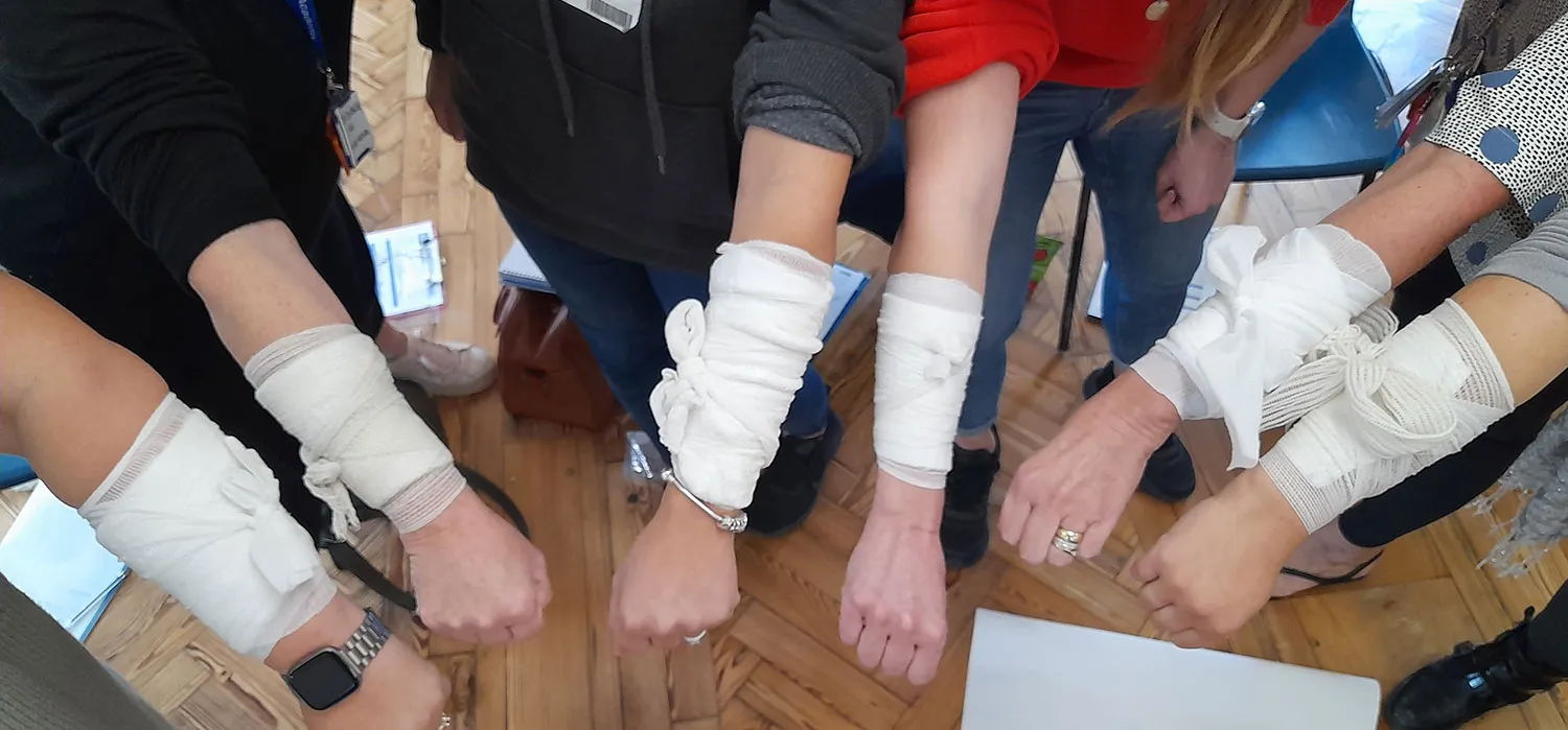 A group of people with bandages on their hands.